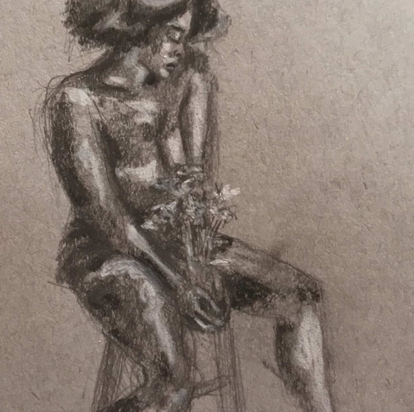 Lady sitting with the flowers 